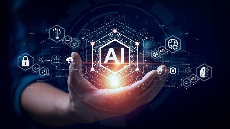 Human hand holding a hologram of icons respresenting AI and data.