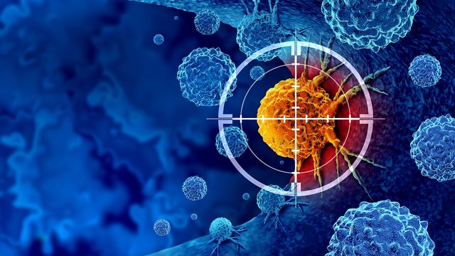 An orange cancer cell under a set of crosshairs, with blue normal cells surrounding it. 