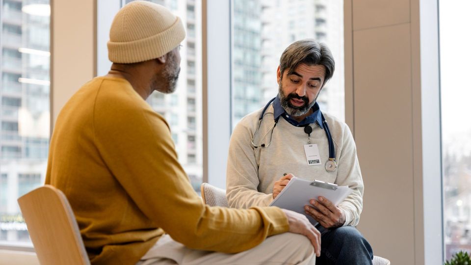 Doctor consulting with a patient during a medical appointment.