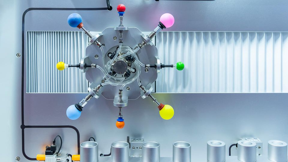 Re Engineer Gas Chromatography system with multi-port valve assembly and color-coded flow controls in laboratory instrumentation.