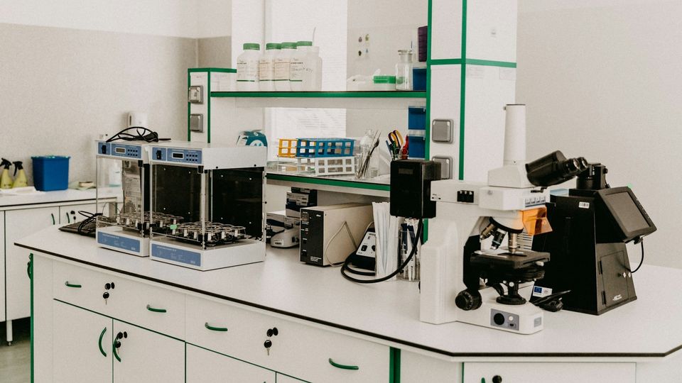 Modern biomedical laboratory with microscopes.