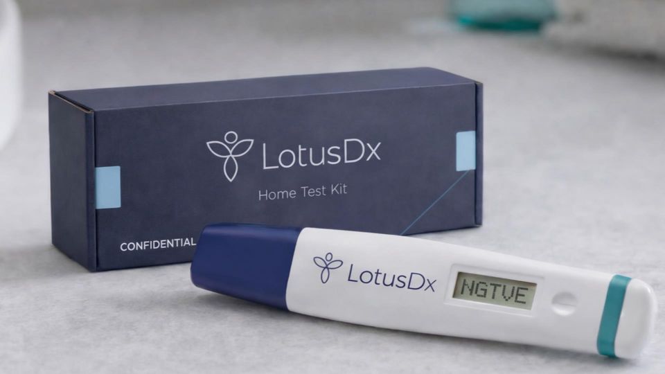 LotusDx home test kit with digital test device displaying a negative result.
