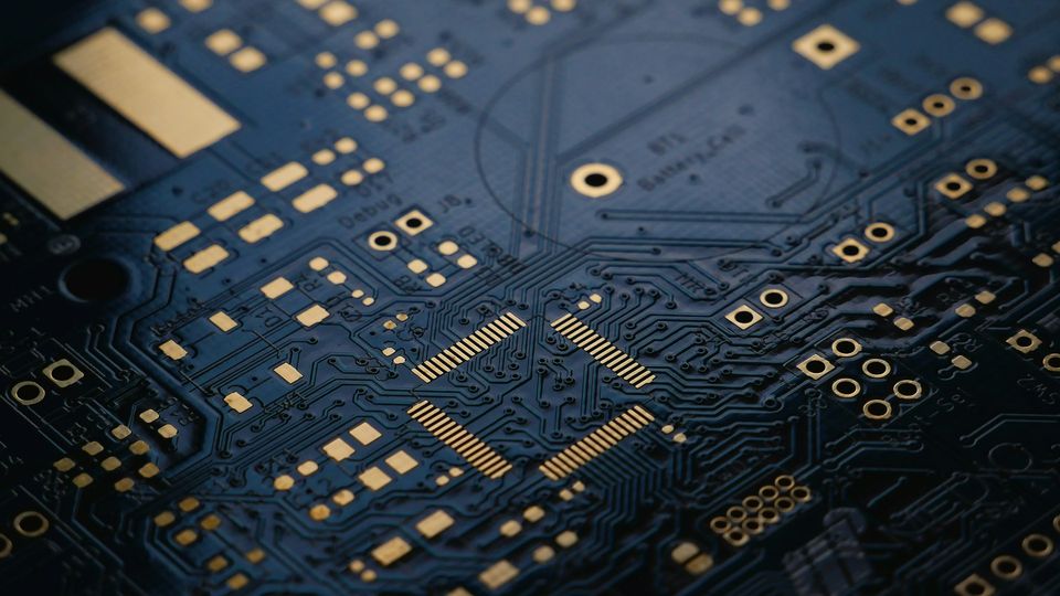 Printed circuit board (PCB) with intricate electronic traces and component connections.