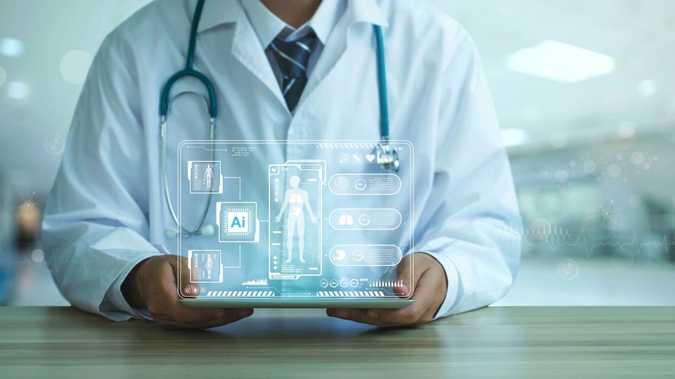 Seated doctor holding a tablet displaying a hologram of patient data.