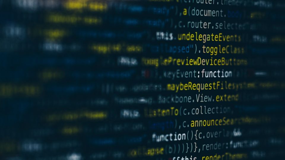 Computer coding screen displaying software source code in yellow and white on a black background.