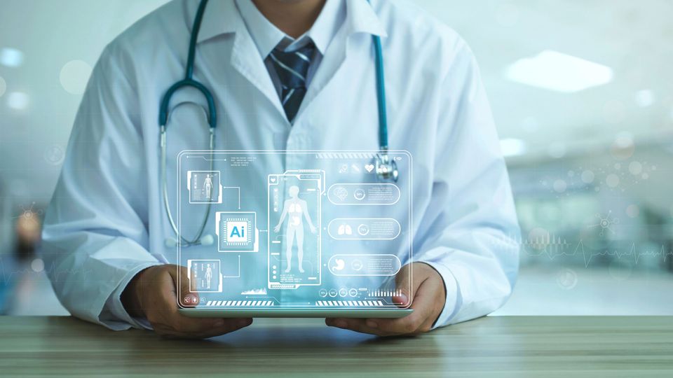 Seated doctor holding a tablet displaying a hologram of patient data.