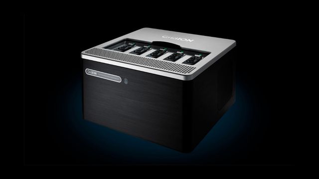 GridION benchtop sequencing device with five flow cell slots, shown in black and silver against a dark background. 