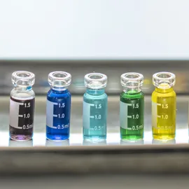 Colorful laboratory vials symbolize Pride in STEMM, celebrating diversity and inclusion in science.