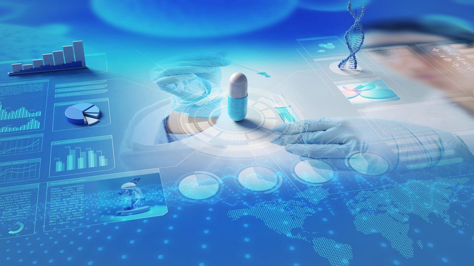 Visual of a white and blue capsule on a surface covered in visual data graphs and pie charts, in various blue shades.