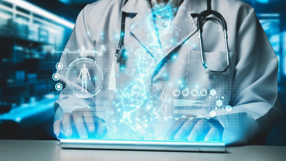Torso of a scientist wearing a laboratory coat, typing on a keyboard. Glowing digital medical icons overlay the image.