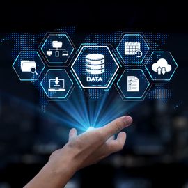Outstretched human hand holding an illuminated illustration of data management icons. 