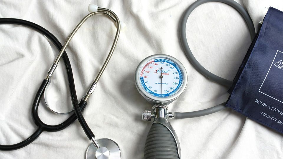 A stethoscope and blood pressure monitor on a white background.