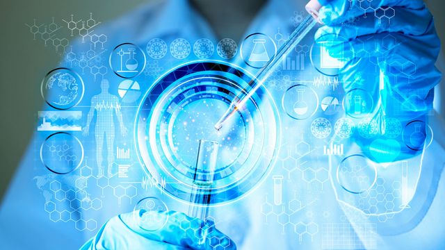 Scientist using a pipette with AI-driven digital lab interface illustrating live-cell analysis and label-free cell segmentation. 