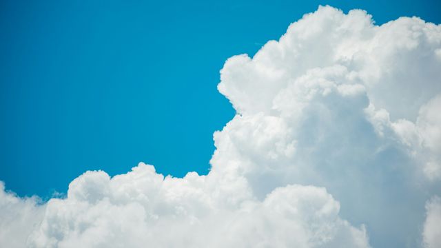 White clouds against a bright blue sky. 