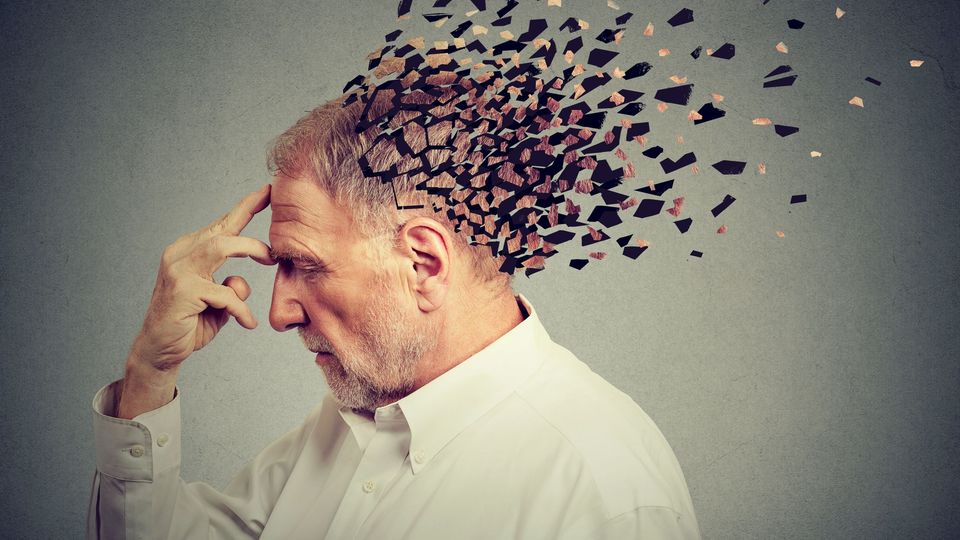 Illustration of a person with a fragmented head silhouette, symbolising brain fog and memory difficulties.