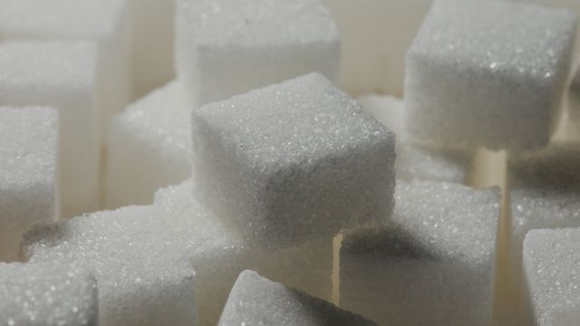 A pile of white sugar cubes. 