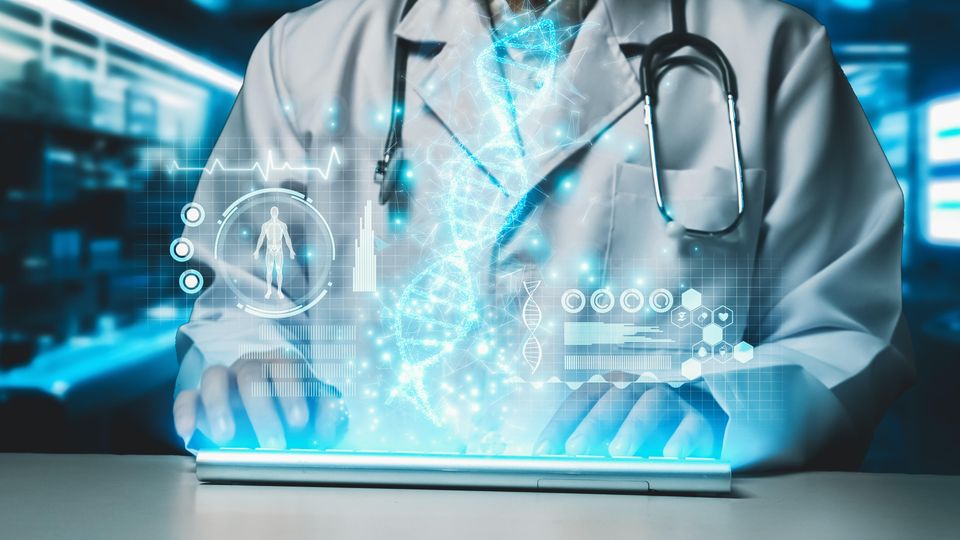 Doctor in a white coat using a laptop projecting a hologram of health data.