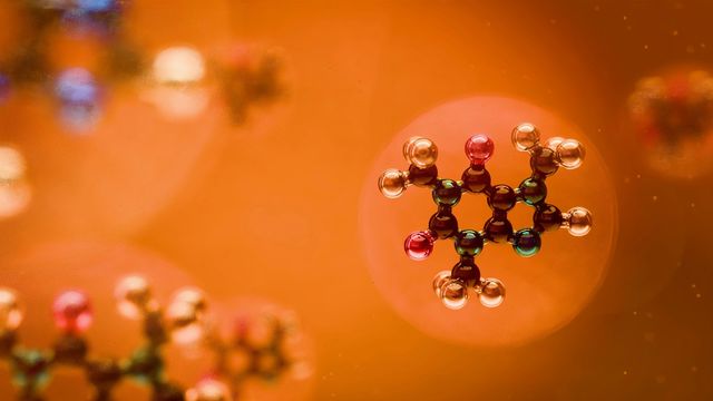 Illustration of a carbon-based molecule structure in a floating bubble. 