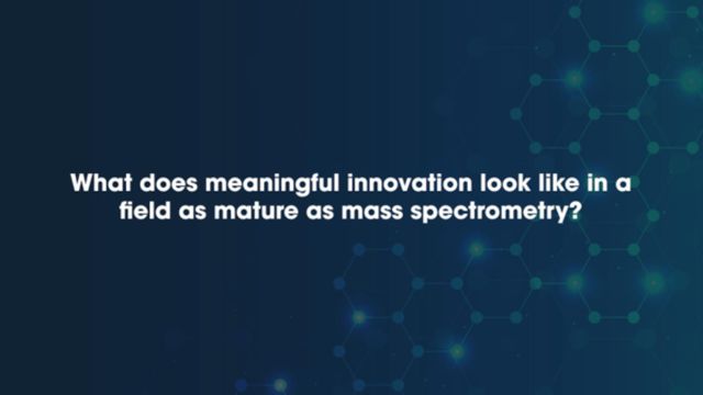The question 'What does meaningful innovation look like in a field as mature as mass spectrometry?' written in white text on a dark blue background. 