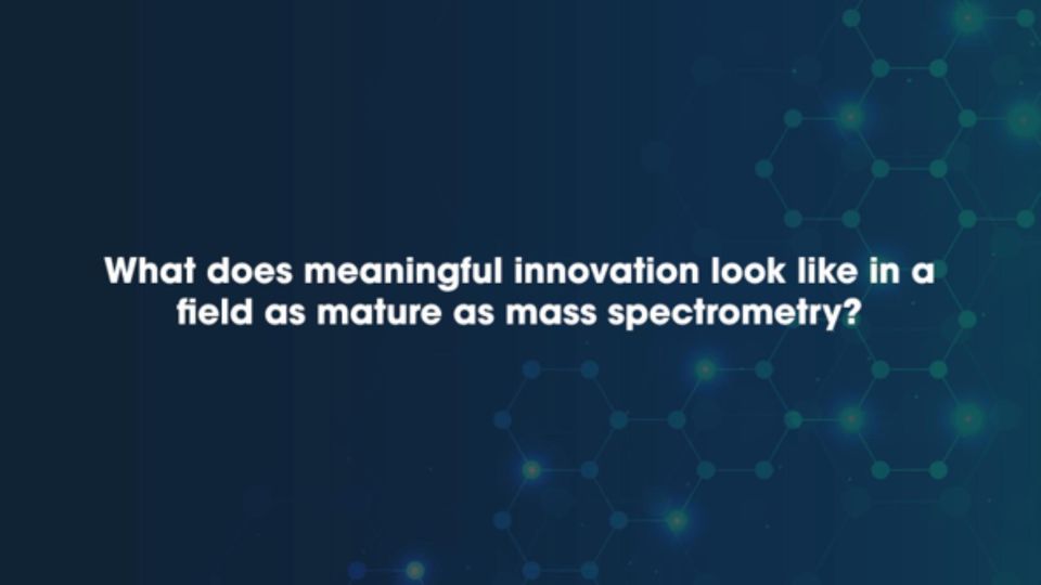 The question 'What does meaningful innovation look like in a field as mature as mass spectrometry?' written in white text on a dark blue background.