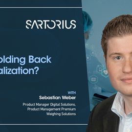 Sebastian Weber smiling next to the title of his presentation "What's Holding Back Lab Digitalization?" 