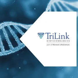 Close-up illustration of a DNA double helix on a blue scientific background alongside the TriLink Biotechnologies logo, representing genetic research, biotechnology