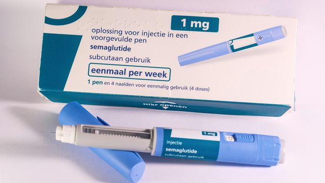 Close-up of a semaglutide injection pen and box. 
