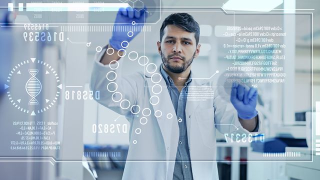 Researcher analyzing spatial multiomics data to advance disease research. 