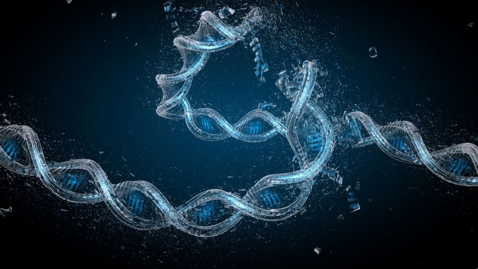 DNA double helix with visible structural damage and fragmented particles.