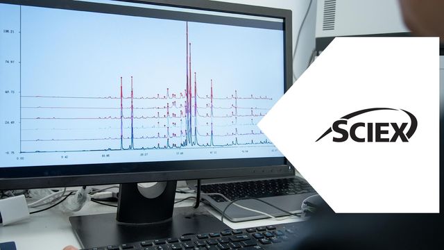 Mass Spec instrument display showing multiple spectral traces and peaks. 