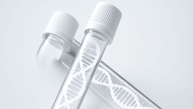 Test tubes with white caps containing white DNA double helices. 