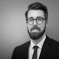 Black and white headshot of Simon Sebastian Wieninger.