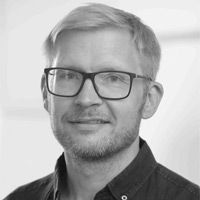 A greyscale headshot of David Andersson