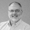 A greyscale headshot of Ken Rosnack