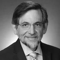 A greyscale headshot of Neal Flomenberg