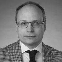 A greyscale headshot of Sam Saibil