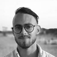 A greyscale headshot of Nicholas Bèchet