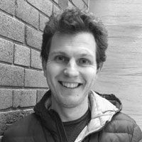 A greyscale headshot of Misha Bashkurov