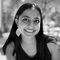 A greyscale headshot of Archana Bettadapur