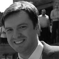 A greyscale headshot of Matthias Dierick