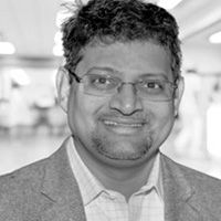 A greyscale headshot of Vishal Mehta