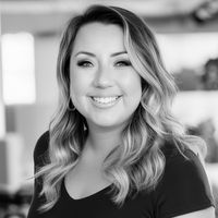 A greyscale headshot of Ellie Juarez