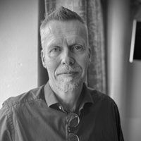 A greyscale headshot of Janne Lehtiö