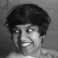 Black and white headshot of Anoutia Allymohamed.