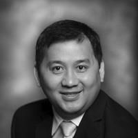 A greyscale headshot of Duc Duong