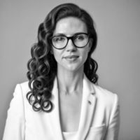 Greyscale Headshot of Krista Kostroman, PhD