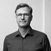 Headshot of Dr. Simon Fredriksson in greyscale.