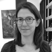 A greyscale headshot of Ghislaine Marchand