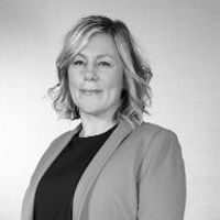 Black and white headshot of Timea Zsiray.