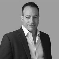 Greyscale image of Gene Mack.